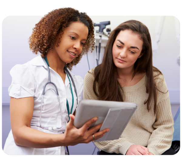 nurse and patient looking down at a tablet