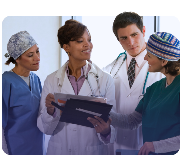 a group of doctors looking over a chart