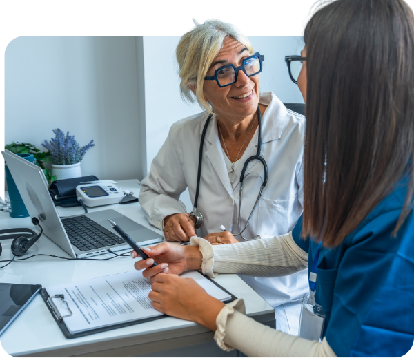 doctor talking to nurse in doctor's office