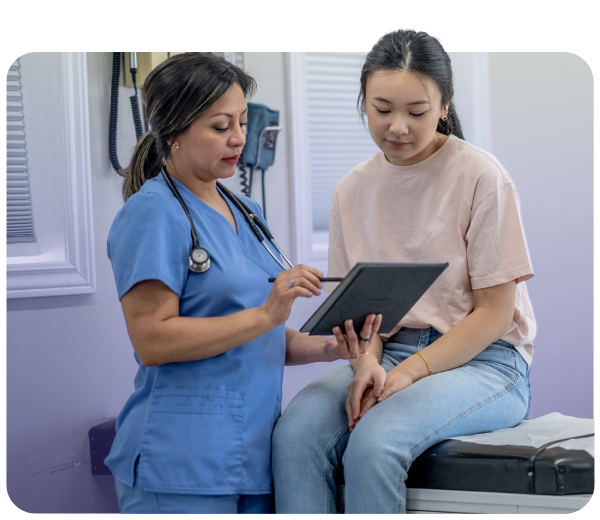 nurse going over chart with patient in her office