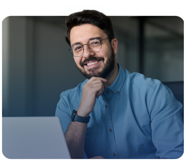 man holding his chin and smiling