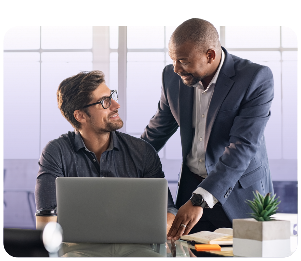 two people in an office having a discussion 
